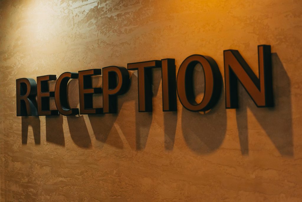 Reception Sign on the Wall in a Hotel